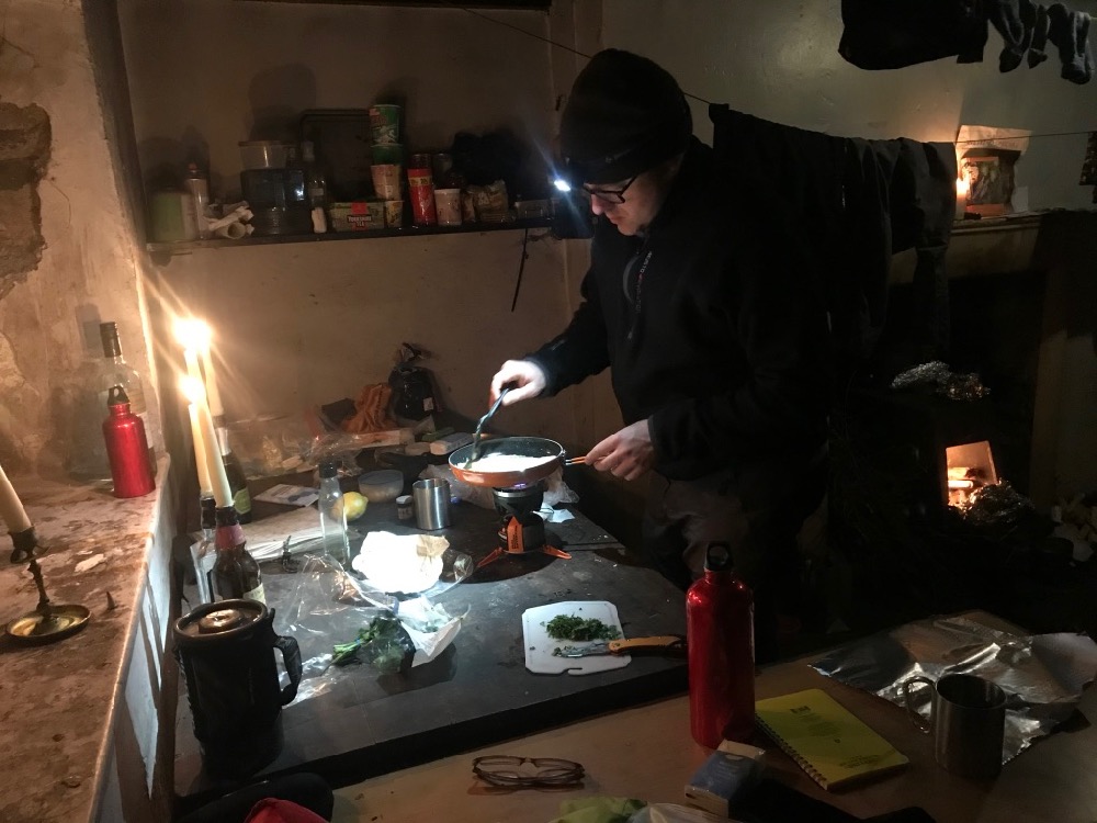 Cooking by candlelight in Nant Syddion Bothy